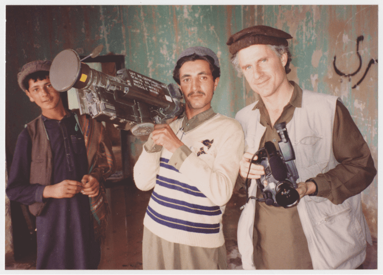 Archival documentary image of journalist George Crile in Afghanistan